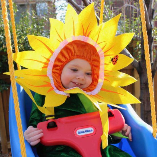 June in sunflower costume on swing