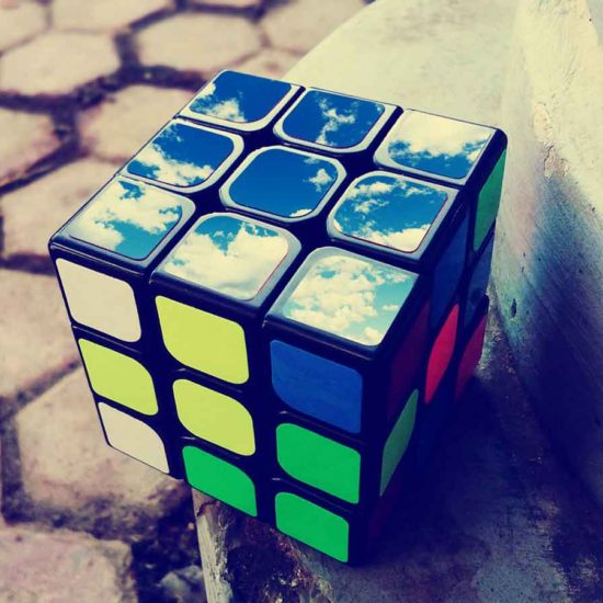 Rubik's Cube with sky and clouds